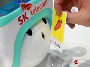 SK Telecom's learning robot Atti reads a card